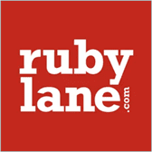 A red square with the words ruby lane. Com written in white