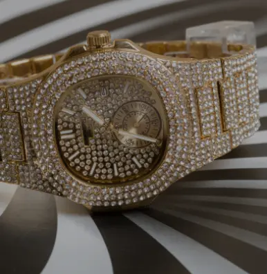 A gold watch with diamonds on it